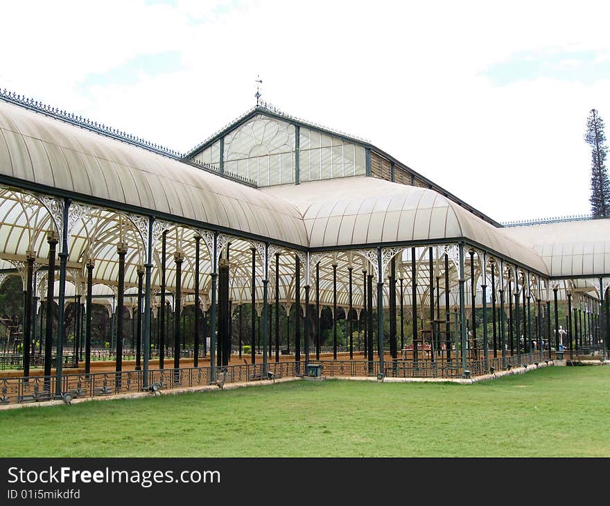 This is a large glass house which has been constructed with a lot of lean metal pillars which adds strength and elegance to the building. It is from lalbagh, Bangalore, India. This is a large glass house which has been constructed with a lot of lean metal pillars which adds strength and elegance to the building. It is from lalbagh, Bangalore, India.