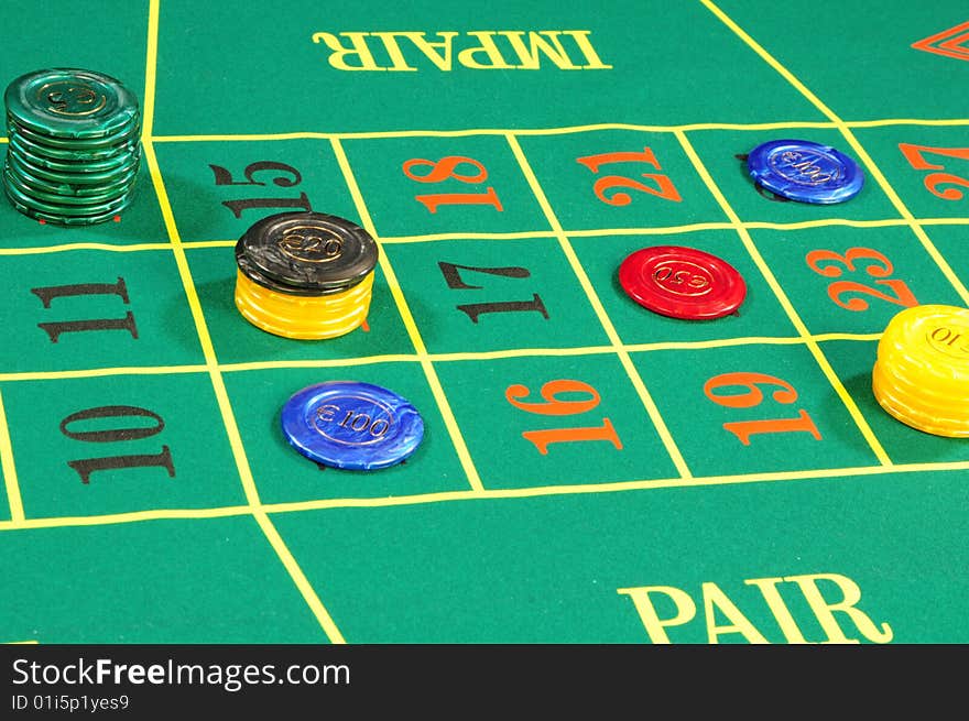 Casino chips on green felt