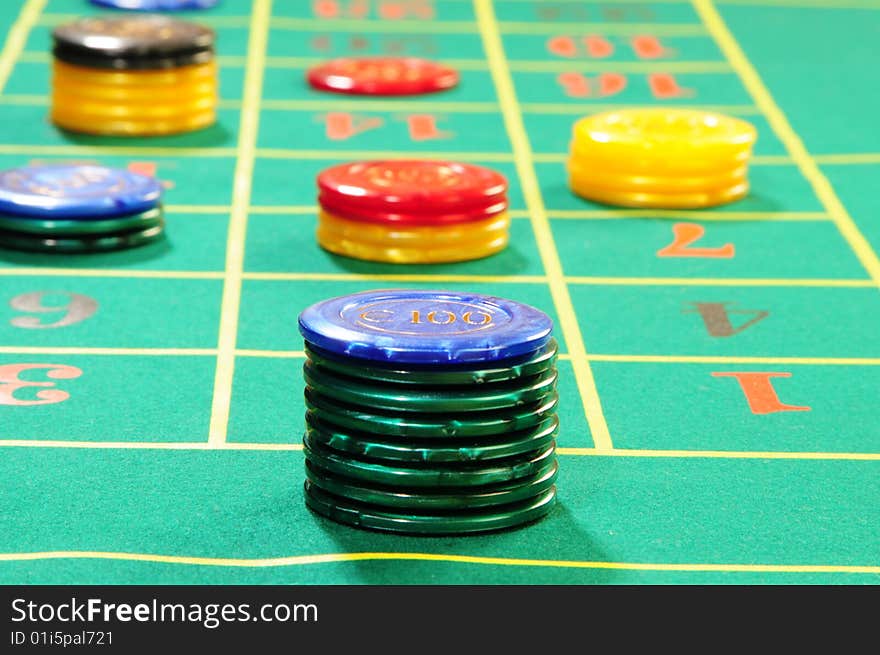 Casino chips on green felt