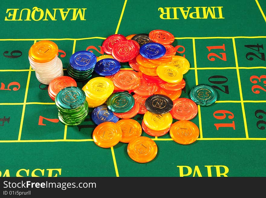 Large group of chips on green baize