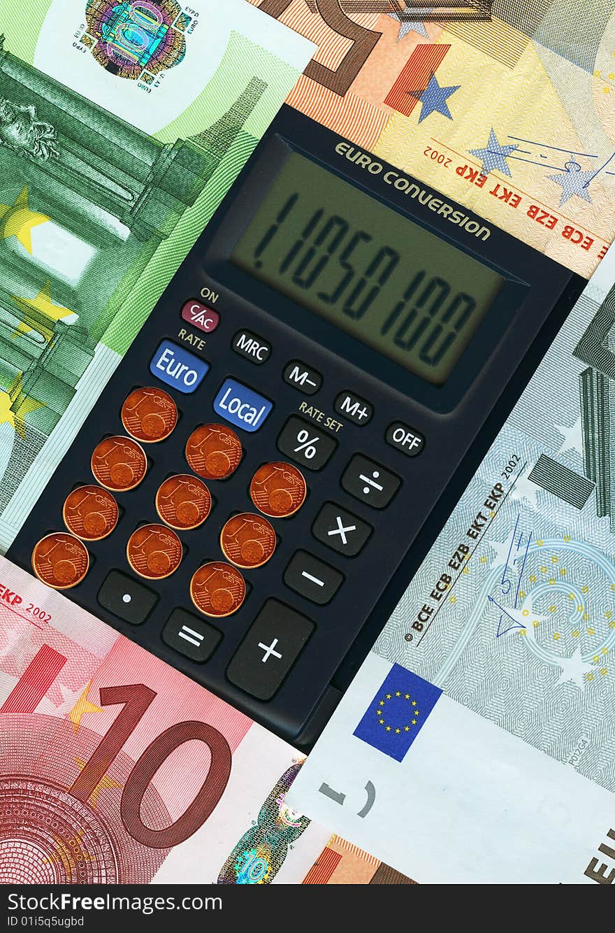 Euro paper currencies with calculator, closeup.