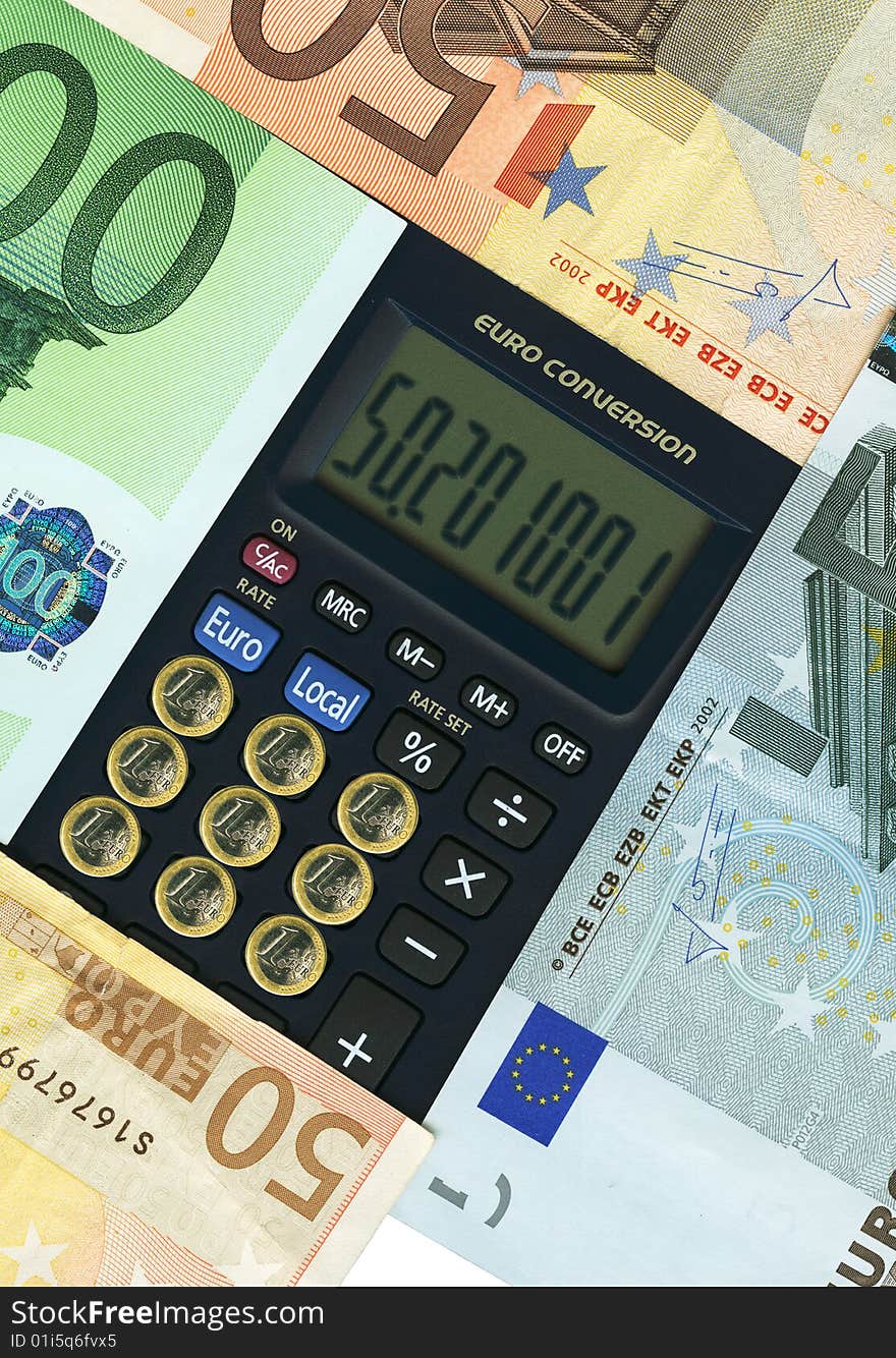 Euro paper currencies with calculator, closeup.