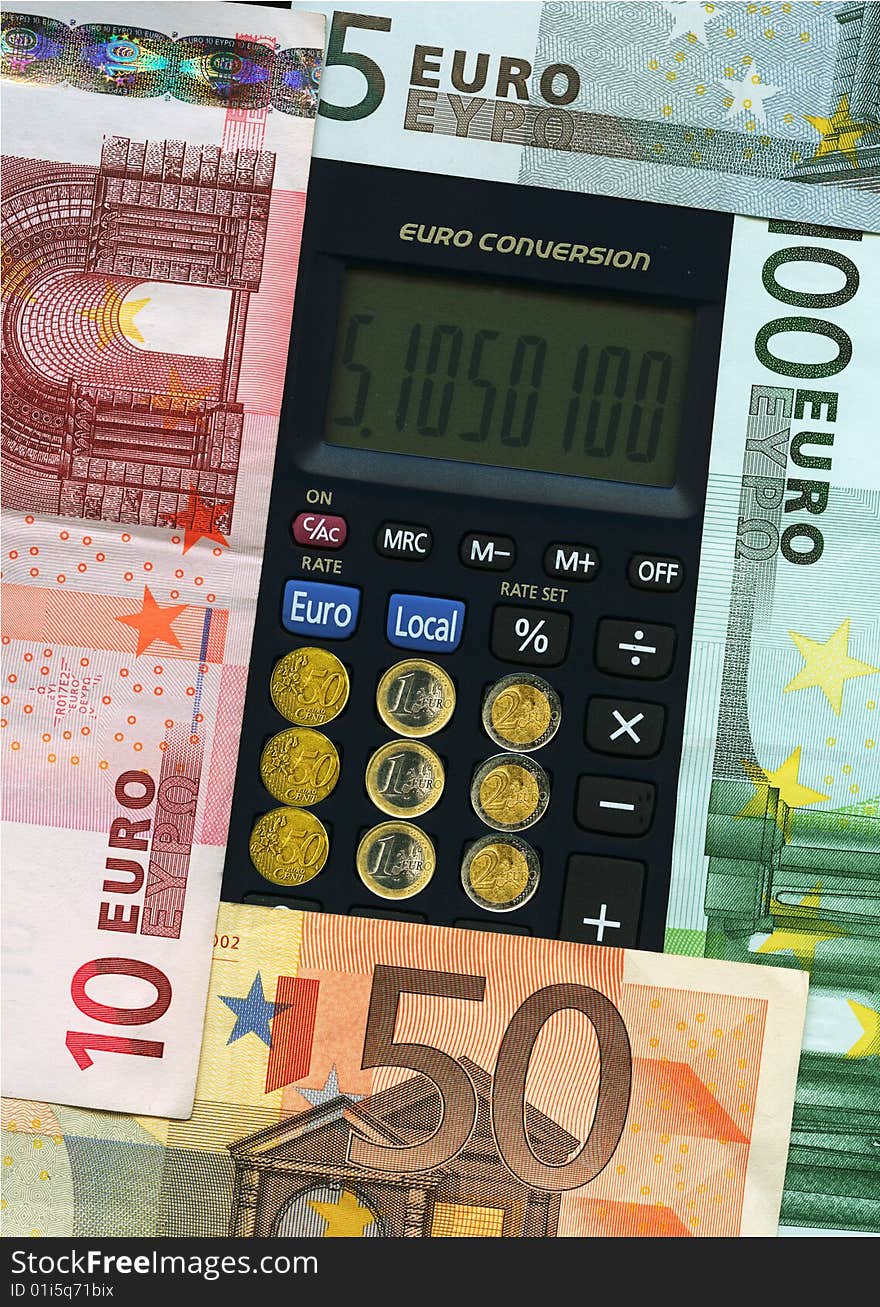 Euro paper currencies with calculator, closeup.