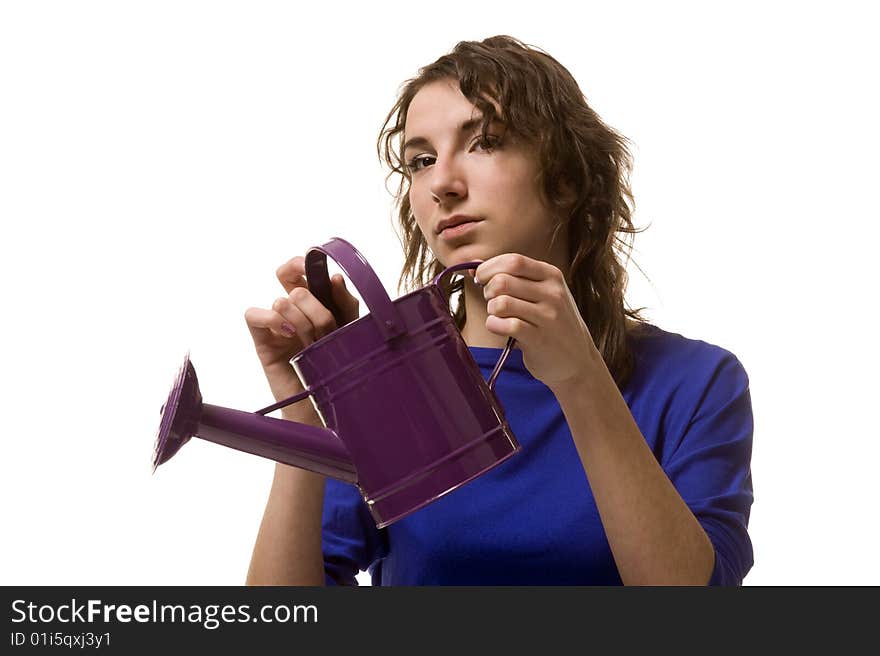 Girl keeps in hands purple watering can. Girl keeps in hands purple watering can