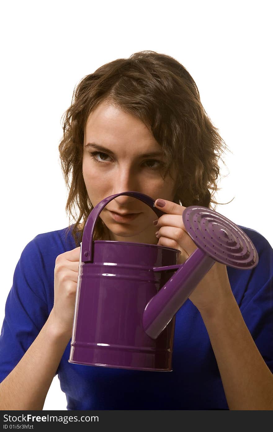 Girl keeps in hands purple watering can. Girl keeps in hands purple watering can