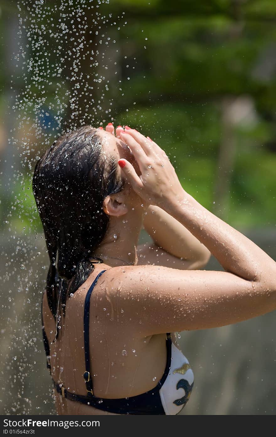 Young girl in the outdoor shower