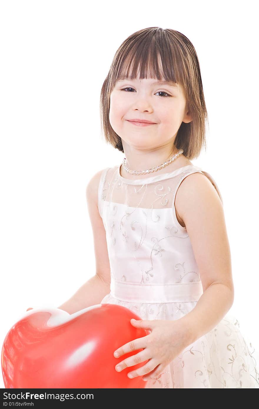 Smiling little girl holds on red balloon