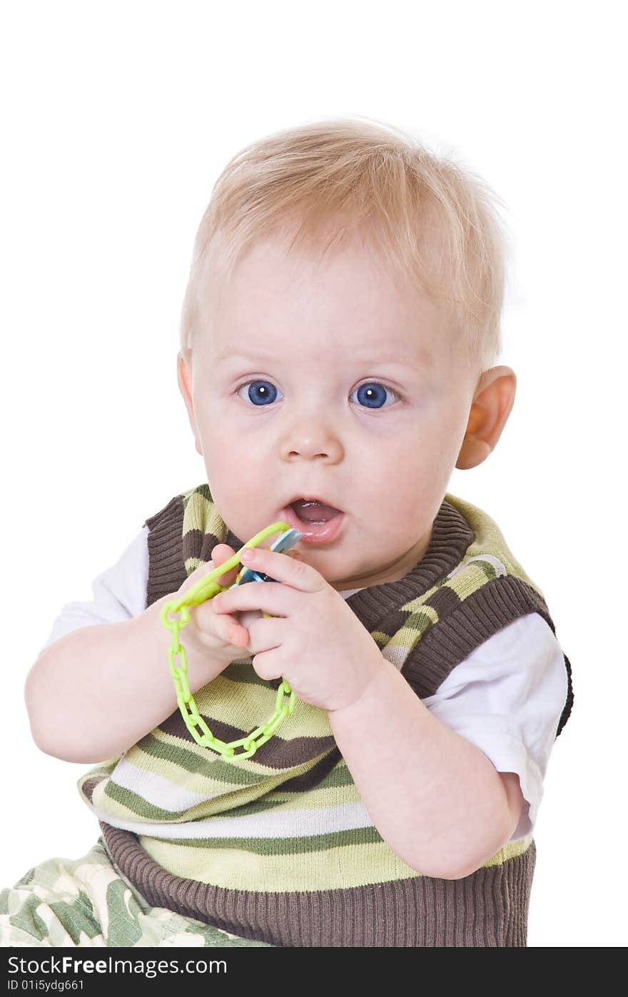 Little boy in a green vest on white background