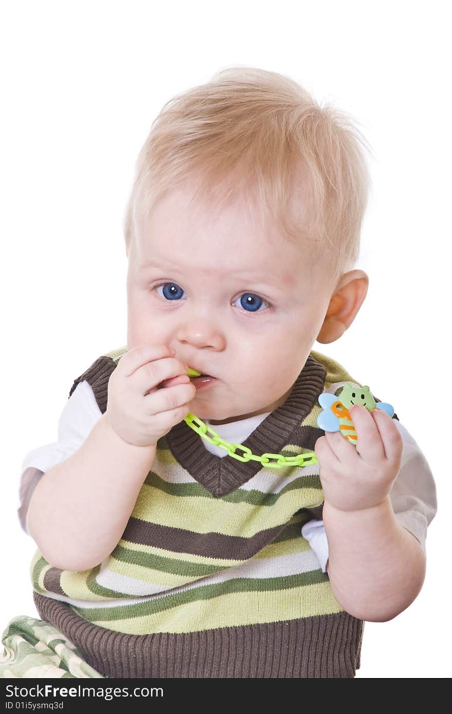 Little boy in a green vest on white background