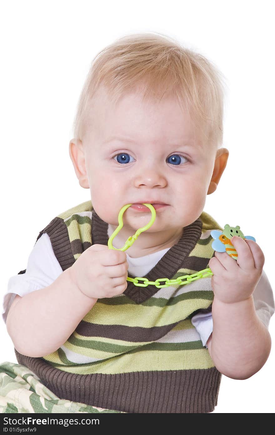 Little boy in a green vest on white background