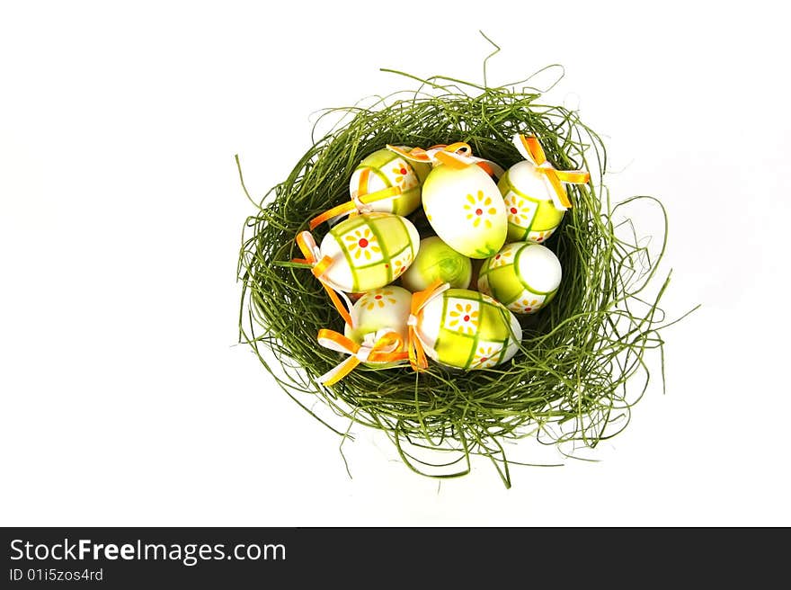 Easter eggs in basket isolated on white