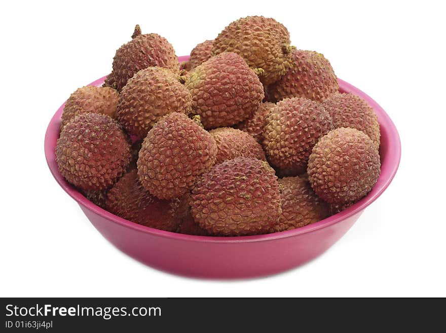 Fresh litchis in a bowl - isolated on white background. Fresh litchis in a bowl - isolated on white background