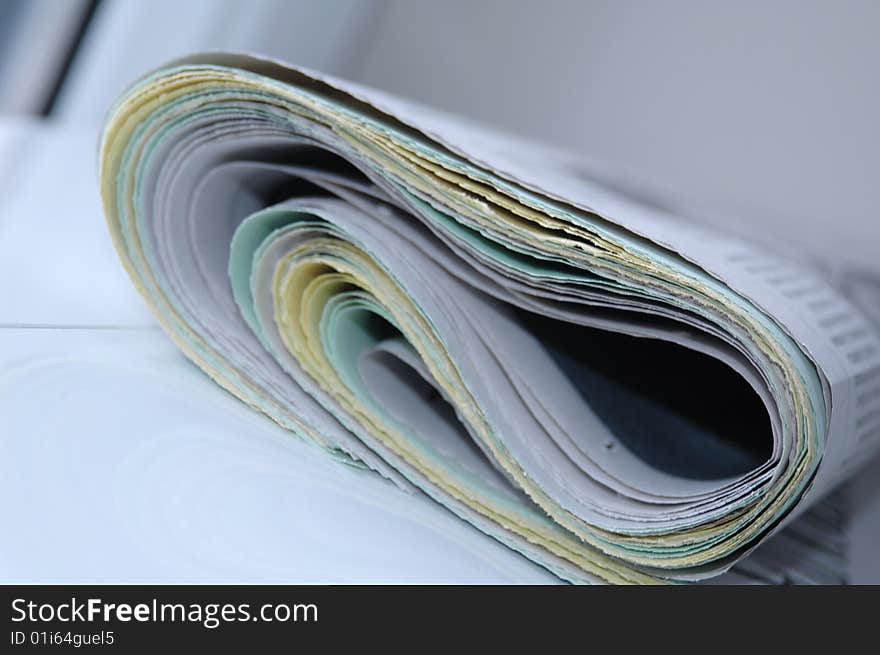 A folded newspaper casted with blue light