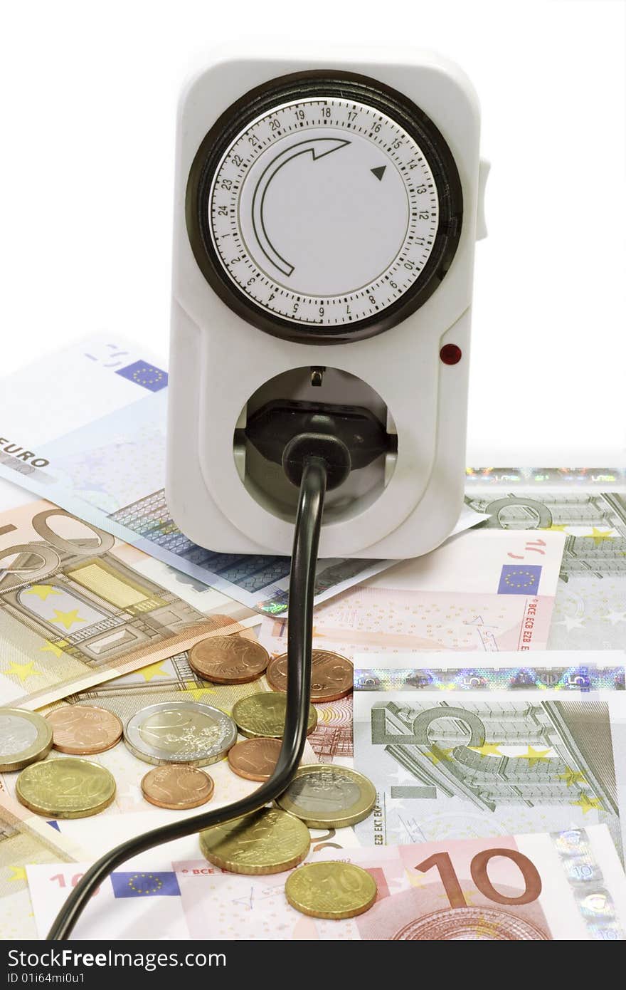 24 hours mechanical timer with Euro coins and bills over white background