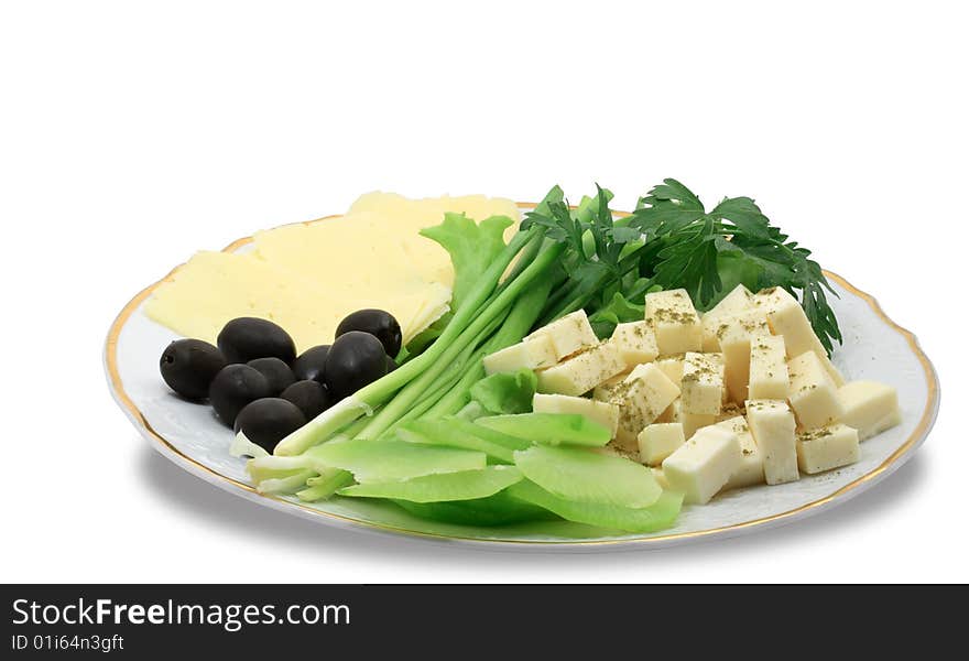 Plate with cheese and greens isolated on white background