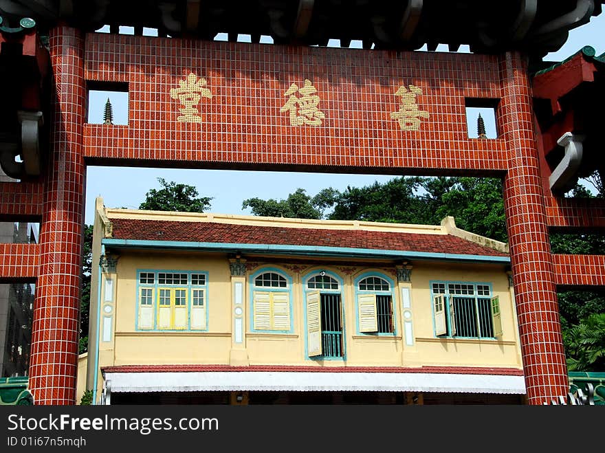 View through the entry gate to the small colonial style Shan De Tang Chinese Temple on Cavenagh Road
in Singapore - Lee Snider Photo. View through the entry gate to the small colonial style Shan De Tang Chinese Temple on Cavenagh Road
in Singapore - Lee Snider Photo.