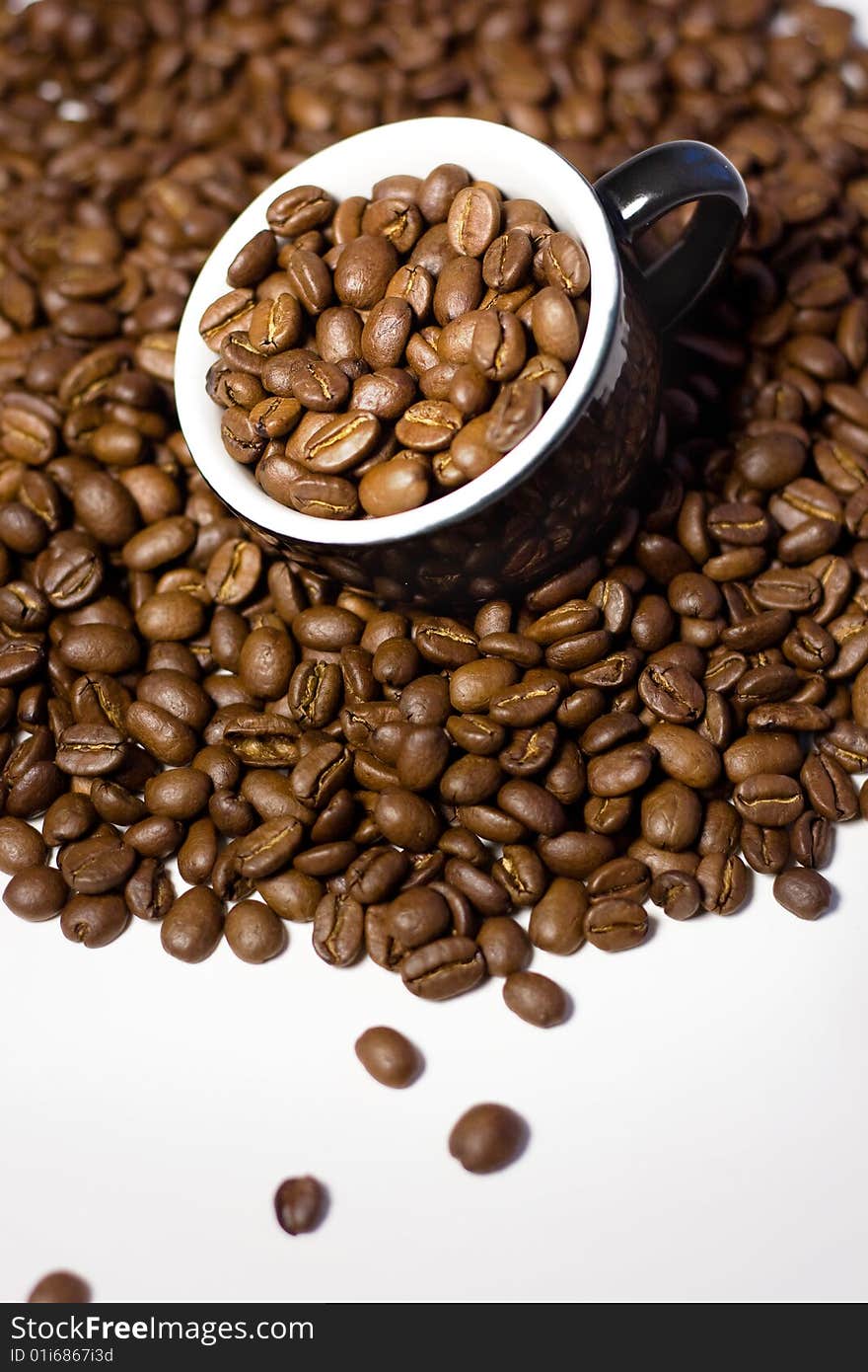 Coffee beans in the cup.Close up.