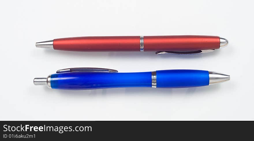 Closeup of two retractable ballpoint pens