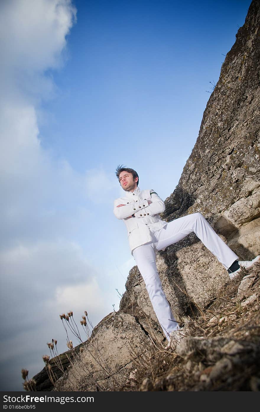 Stylish man outdoors, low angle view