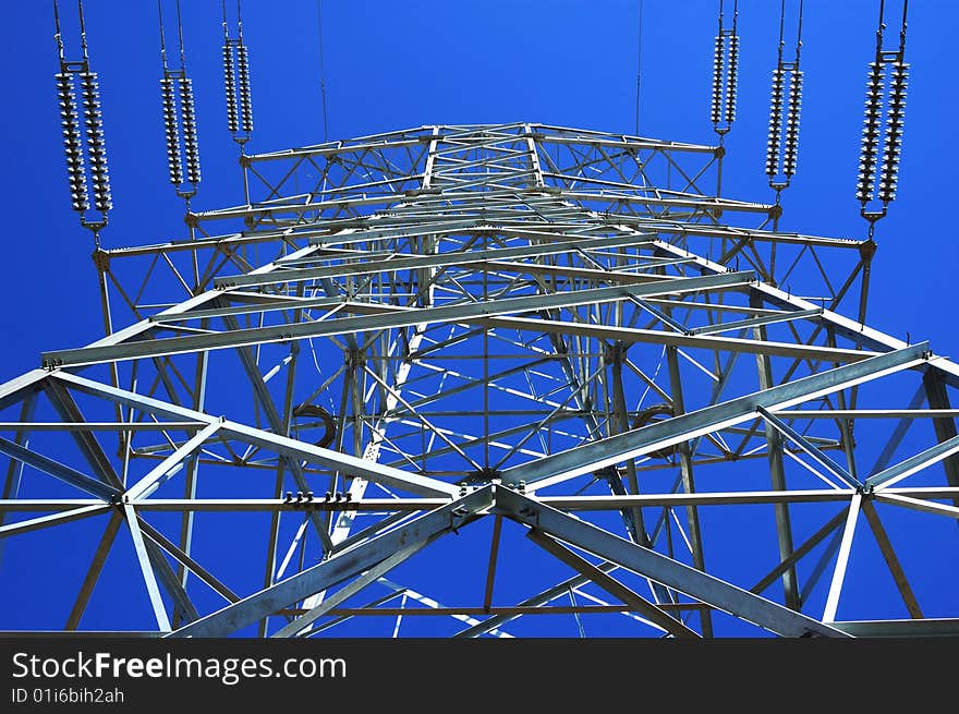 High voltage electricity pole under sky