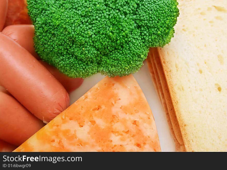 Bread,cheese,broccoli and sausage. Bread,cheese,broccoli and sausage.