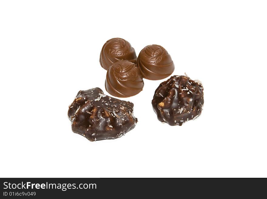 Delicious chocolate candies on a white background. Delicious chocolate candies on a white background