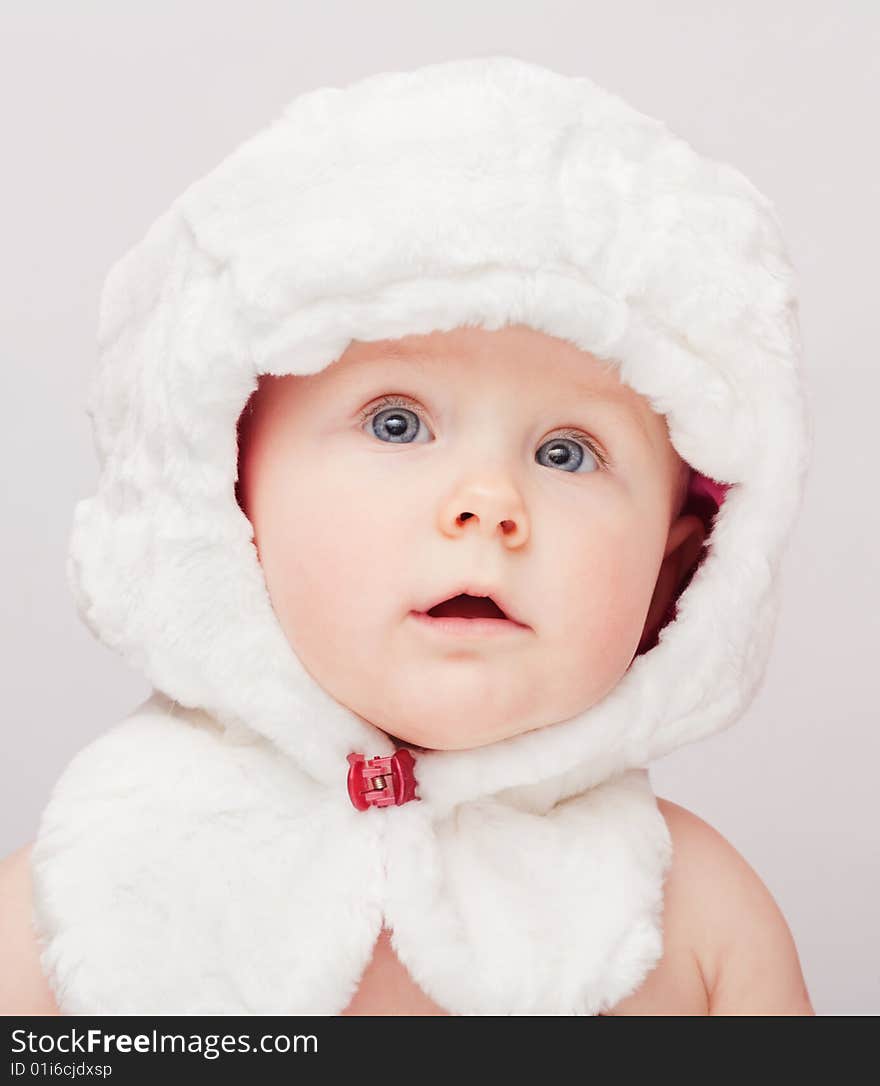 Small cute surprised child in white hat. Small cute surprised child in white hat