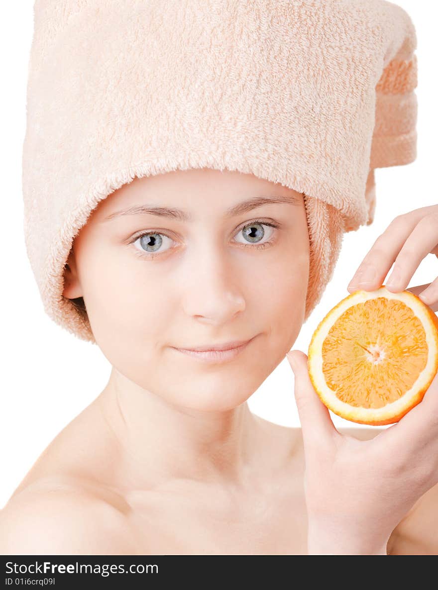 Pretty young girl with a an orange on white background. Pretty young girl with a an orange on white background