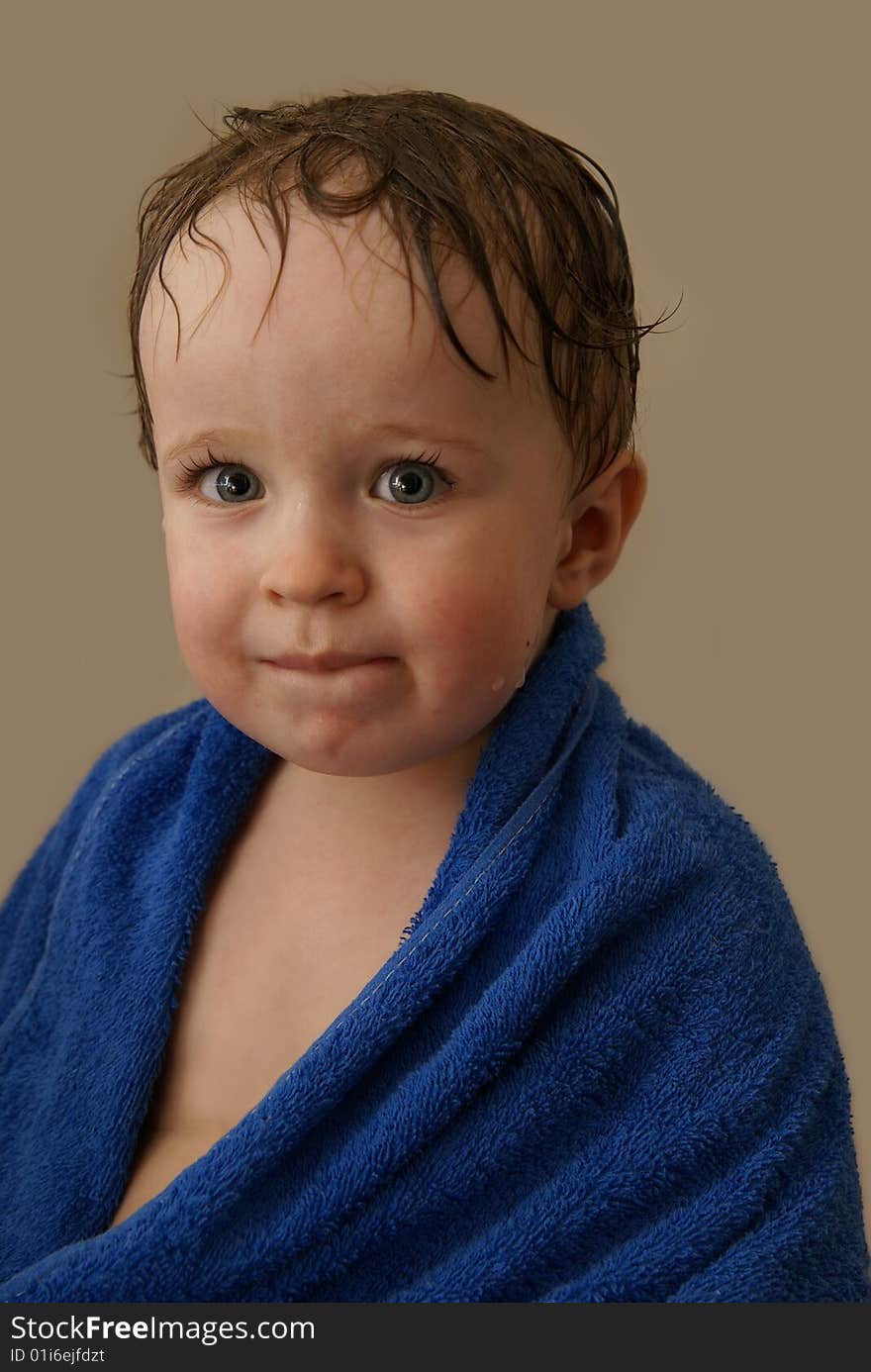 The boy in a towel after bathing