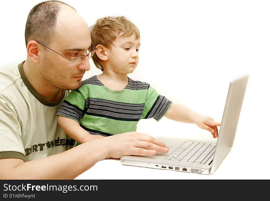 Father and son with laptop over white