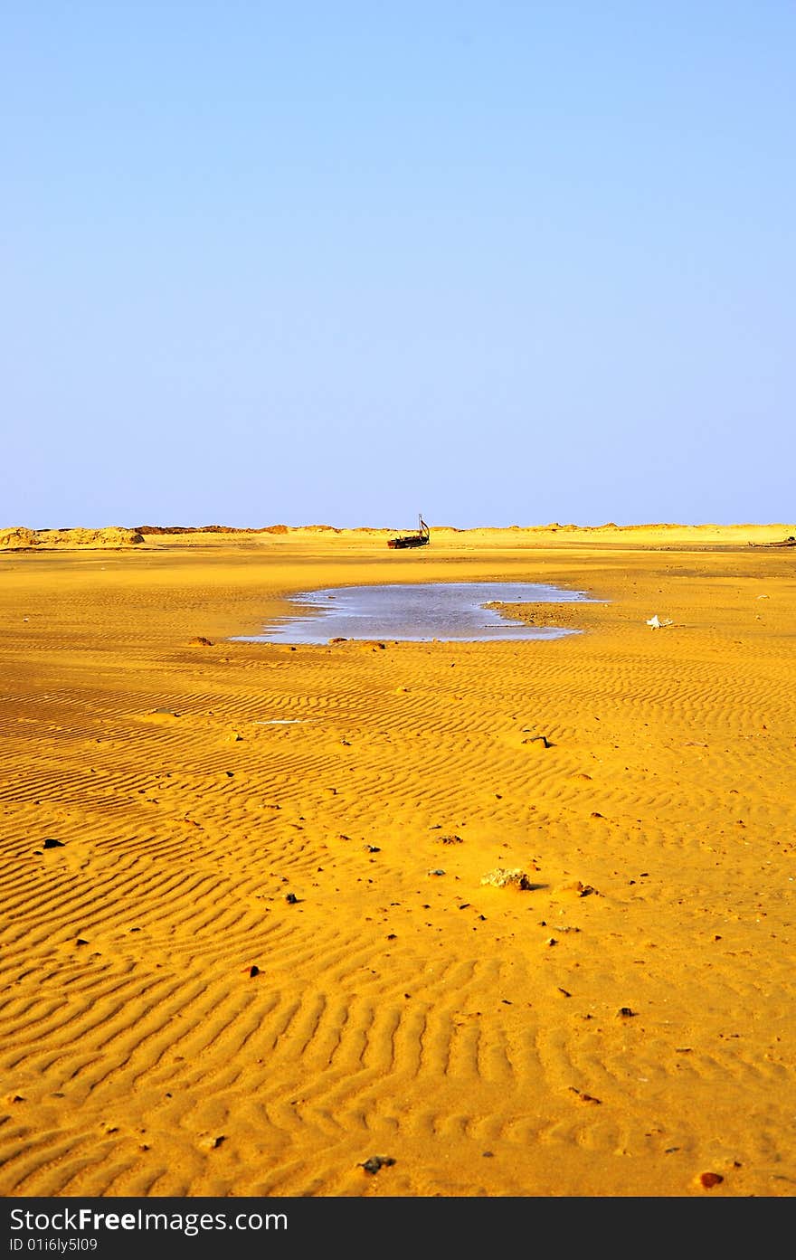 Fishing boat and sand beach