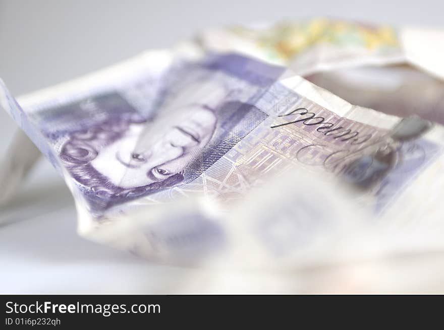 Studio shot of twenty pound banknote. photographed with selective focus (exacted on the eyes of Queen Elizabeth). Horizontal composition. Studio shot of twenty pound banknote. photographed with selective focus (exacted on the eyes of Queen Elizabeth). Horizontal composition.