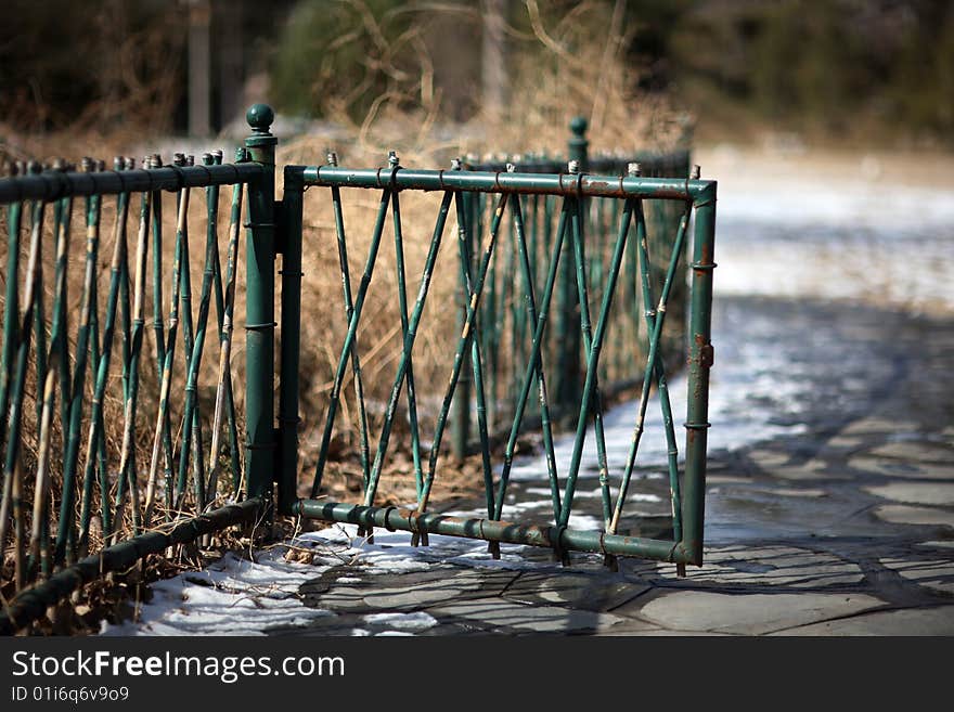 A green fencing in Tsinghua University after snow.