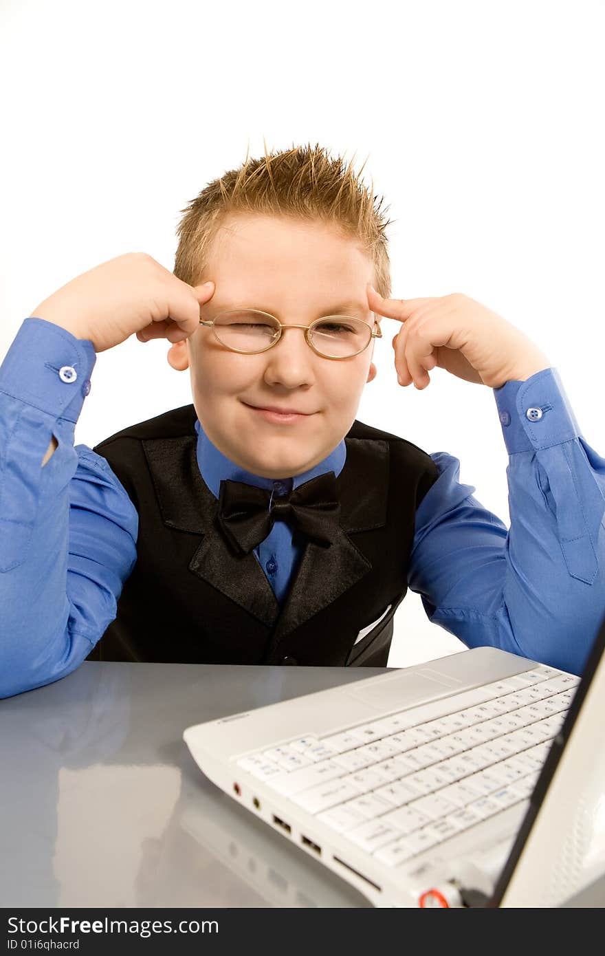 Funny school boy with laptop isolated over white