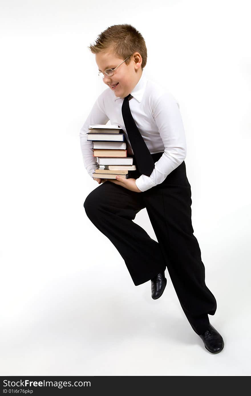 Funny boy running with books isolated on white. Funny boy running with books isolated on white