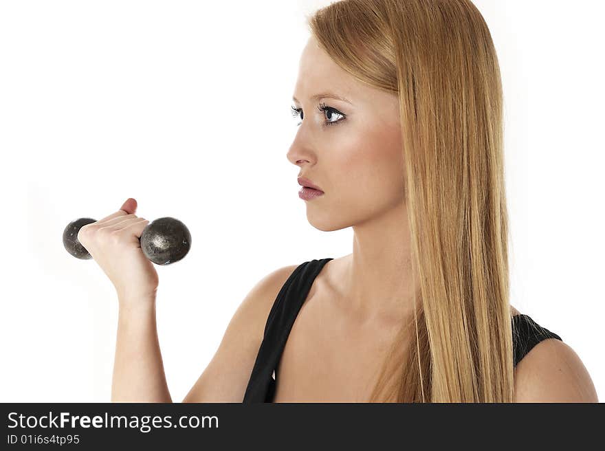 Blond beautiful woman lifting a weight