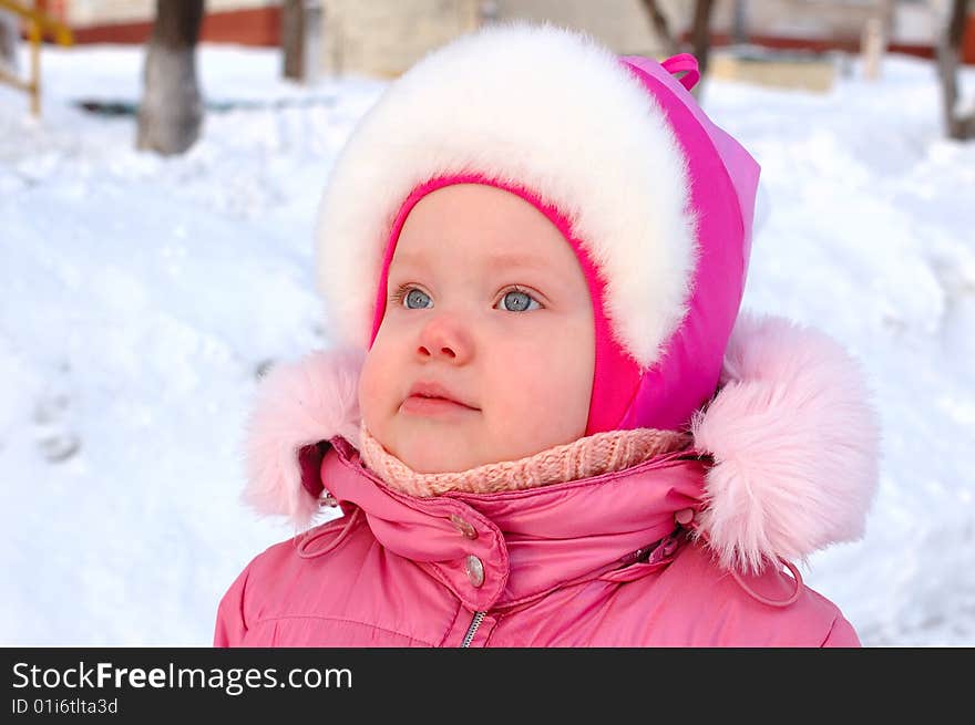 Pretty little girl in winter outerwear.