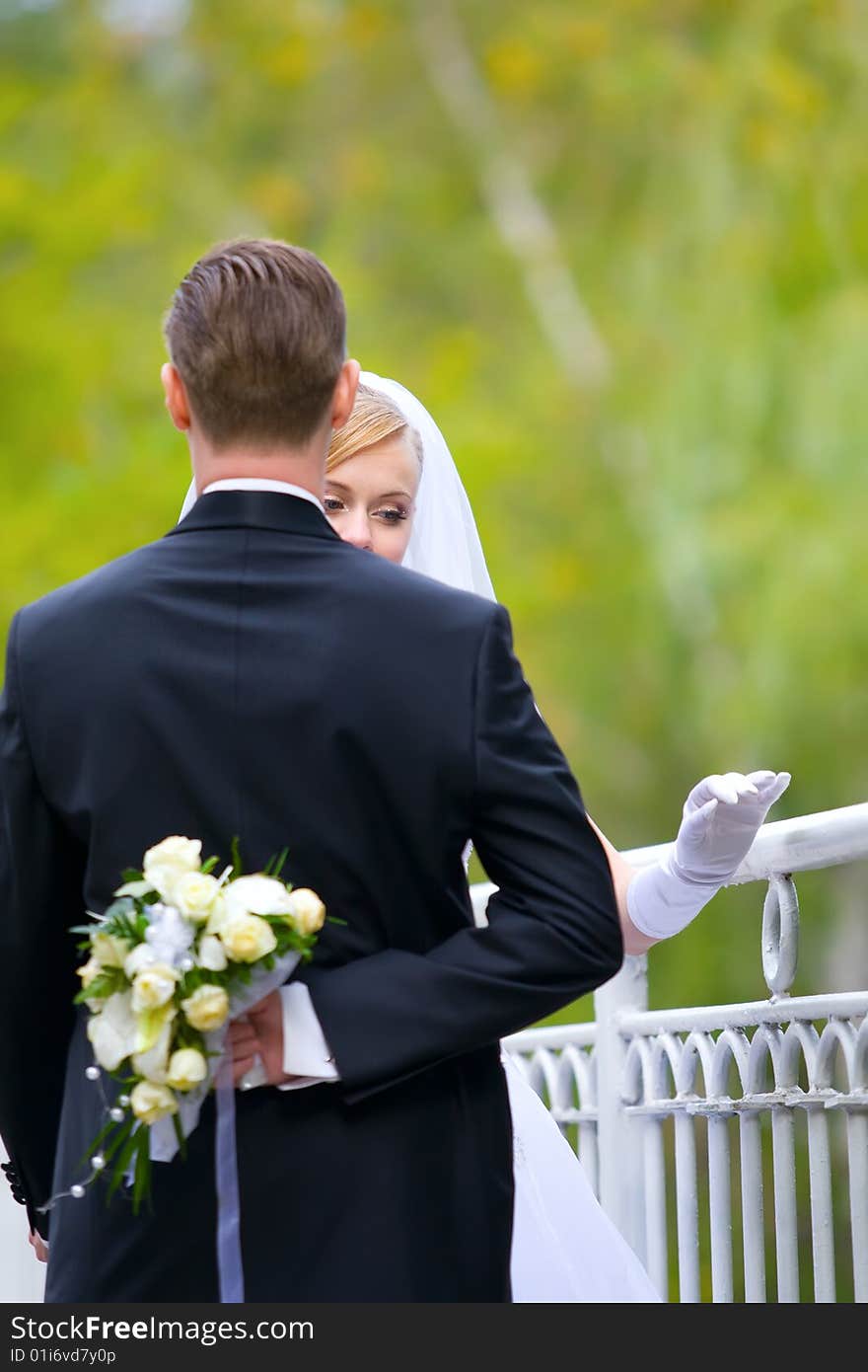 Young groom stays with bride. Young groom stays with bride