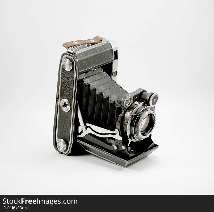 Old film photo camera and isolated on a white background