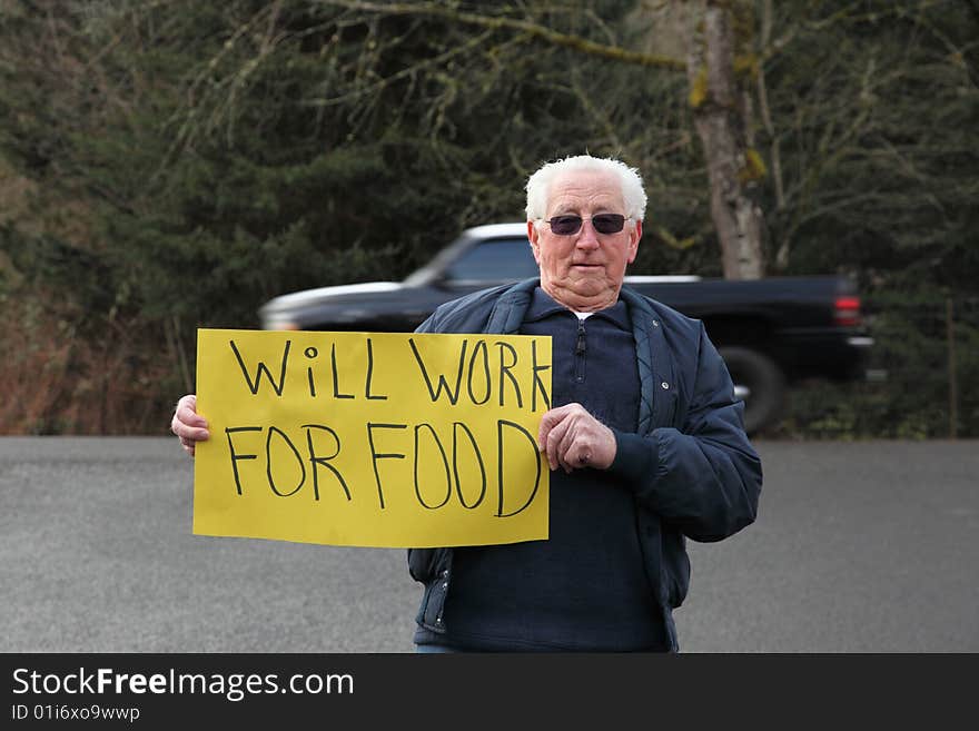 Older Senior Man With Sign For Work