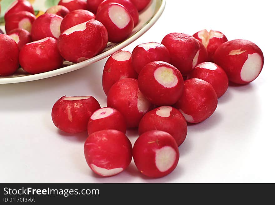 Garden radishes on plate isolated