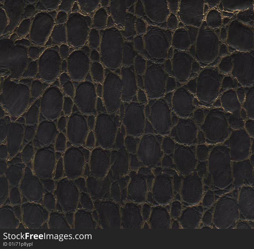 Dark brown leather texture with gold