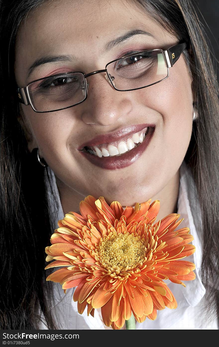 Girl with flower in studio.