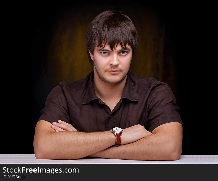 Tough looking young man with watch. Tough looking young man with watch