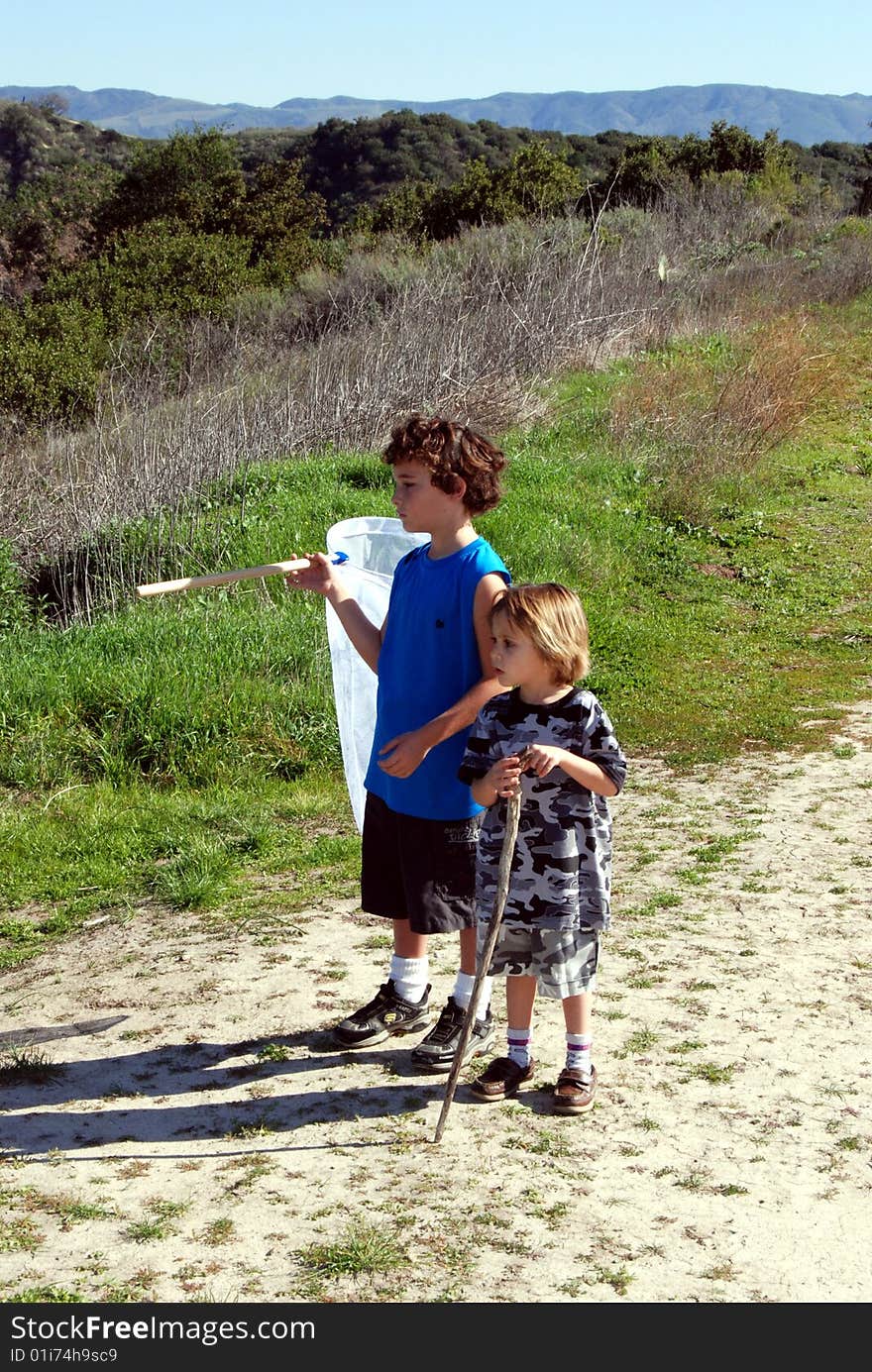 2 brothers, going on a nuture walk looking for bugs. 2 brothers, going on a nuture walk looking for bugs