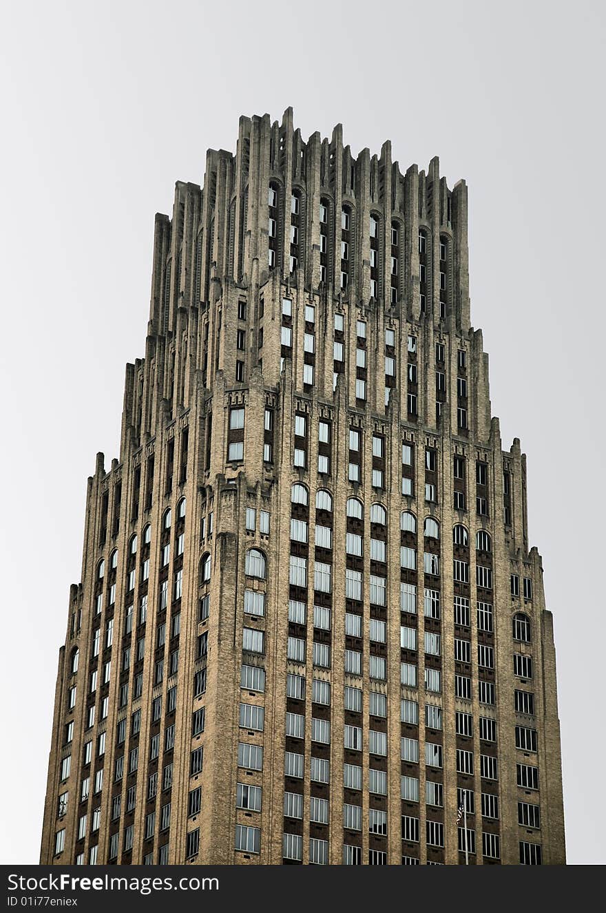 Tall Cathedral-like Skyscraper against gray sky