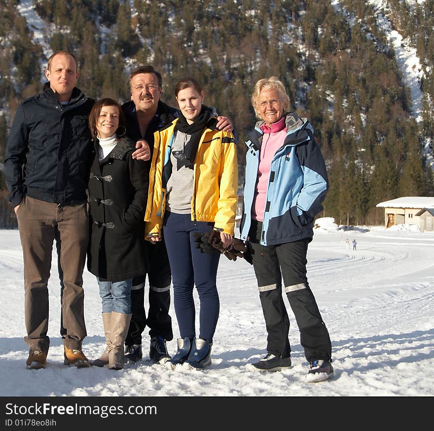 Family in a and outdoor winter setting. Family in a and outdoor winter setting.