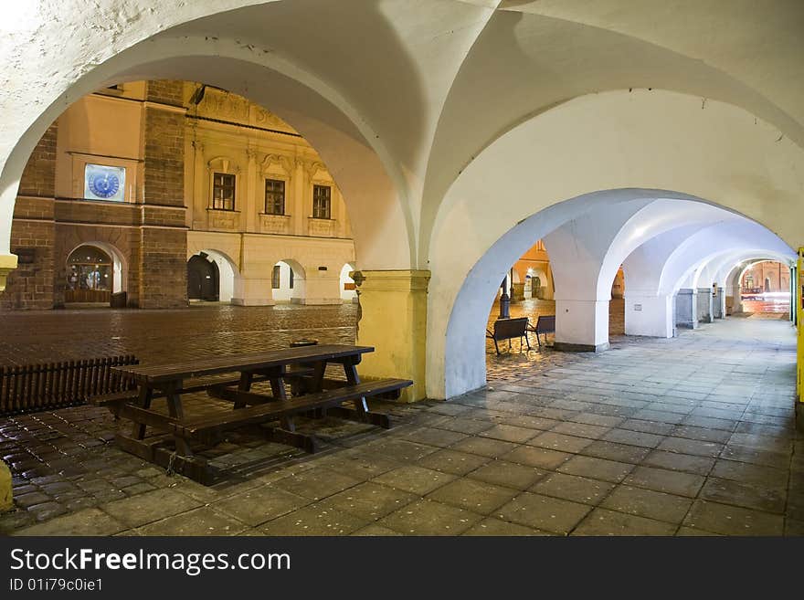 Arcade with town square in Litomysl at night lighting. UNESCO heritage.