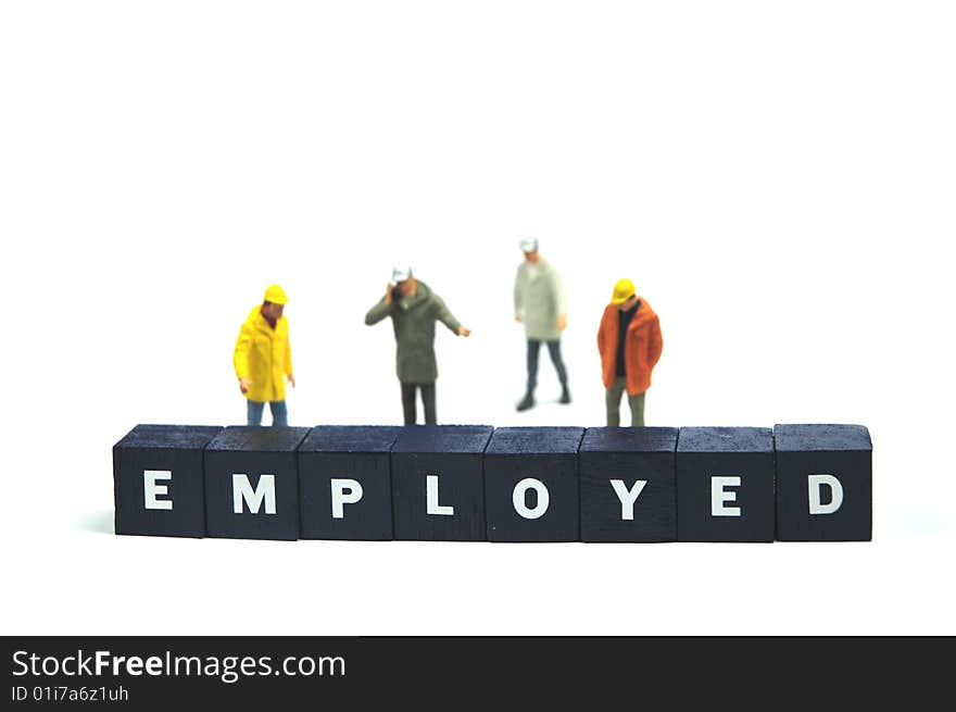 Some figurines behind the word employed