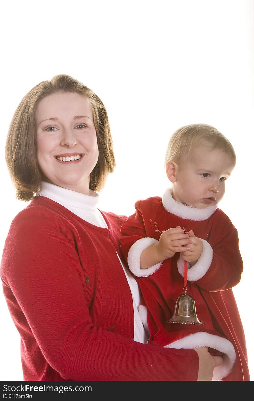 A woman and baby wearing red on a white background. A woman and baby wearing red on a white background